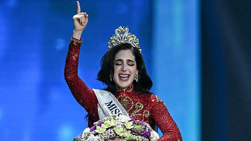 Newly-crowned Miss Universe Fatima Bosh from Mexico points to the sky after she is crowned