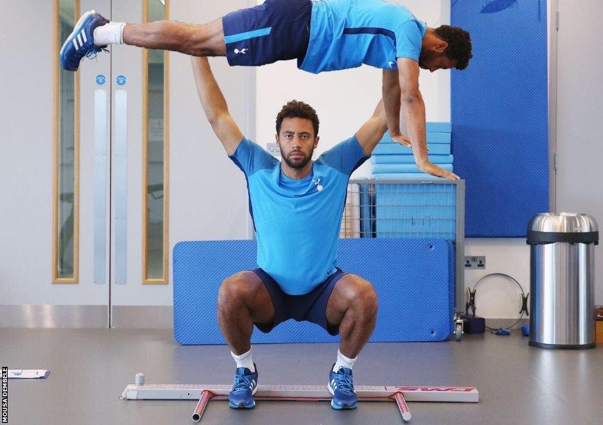 Mousa Dembele lifts a team-mate above his head