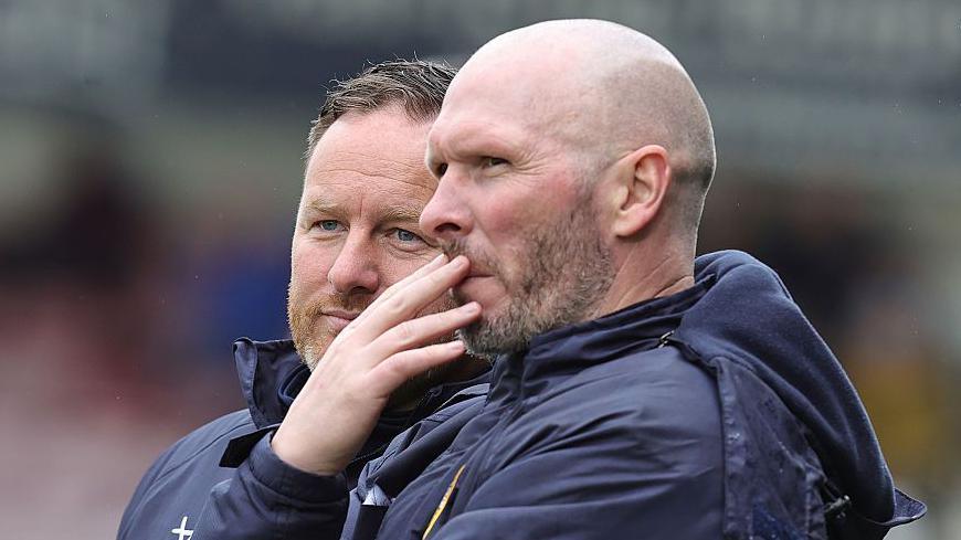 Michael Appleton and Richard O'Donnell pondering from the touchline