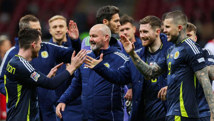 Steve Clarke joins in the celebrations after a dramatic 2-1 win over Poland