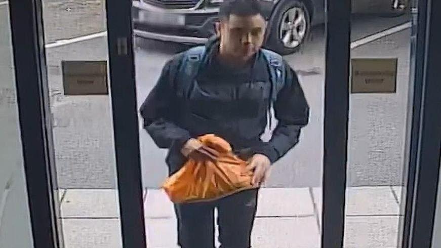 Nasen Saadi is seen on CCTV entering the door of a Travelodge hotel.