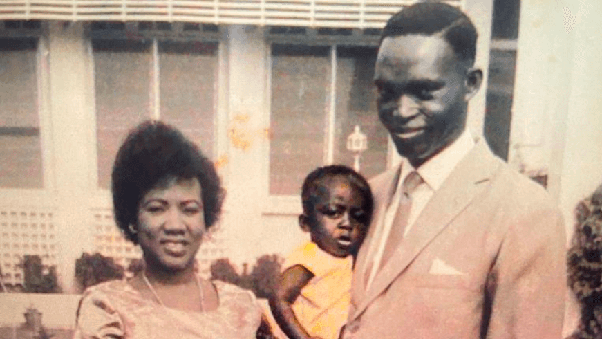 An old photo of a young Mahamudu Bawumia with his mother and father