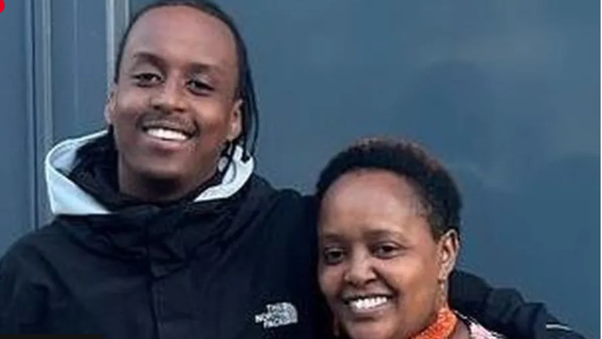 Eddie Kinuthia with his arm around his mother, both smiling broadly