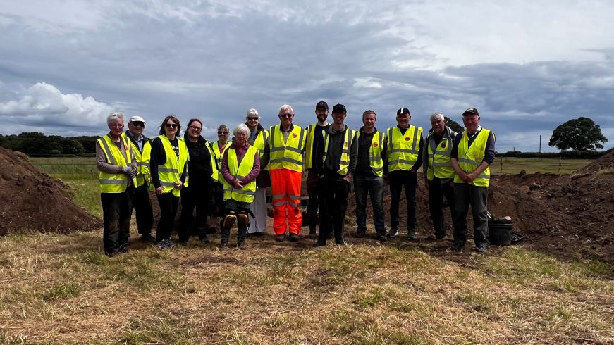 The Norton Disney History and Archaeology Group standing at the dig site in Lincolnshire