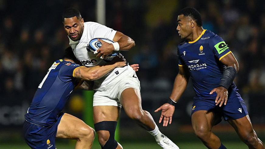 Worcester Warriors players make a tackle during their pre-season friendly against Bath