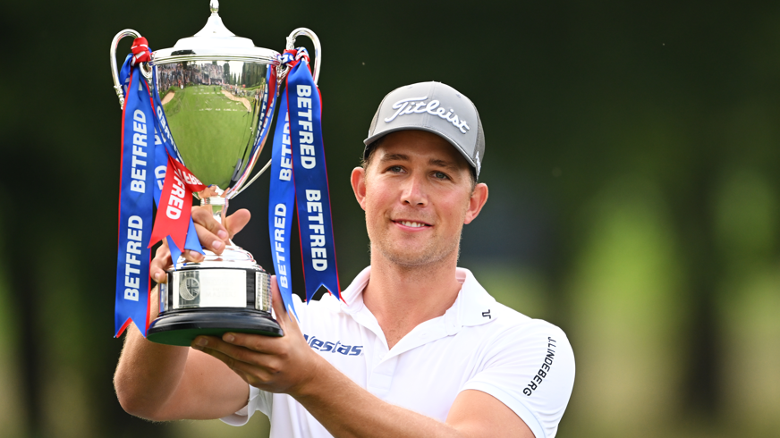 Niklas Norgaard lifts the trophy