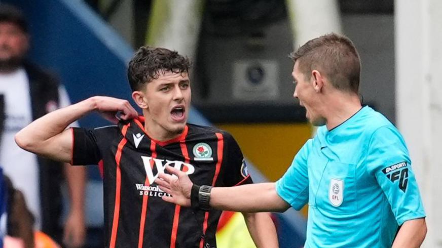 Owen Beck speaks to referee Matt Donohue