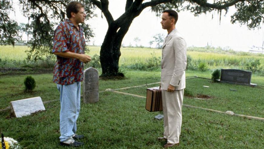 Robert Zemeckis is pictured talking to Tom Hanks on the set of Forrest Gump. They are stood in a graveyard