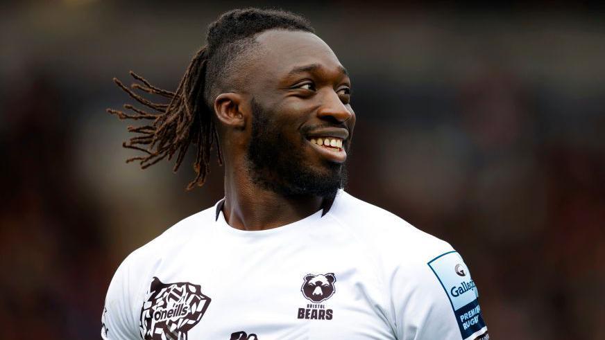 Gabriel Ibitoye smiling on the field during a Bristol match last season