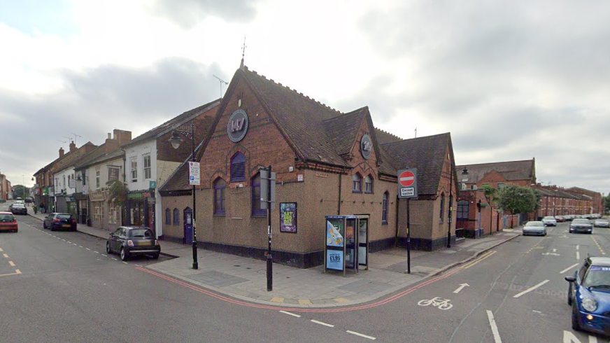 A brown rendered and brick building hosting the 147 nightclub