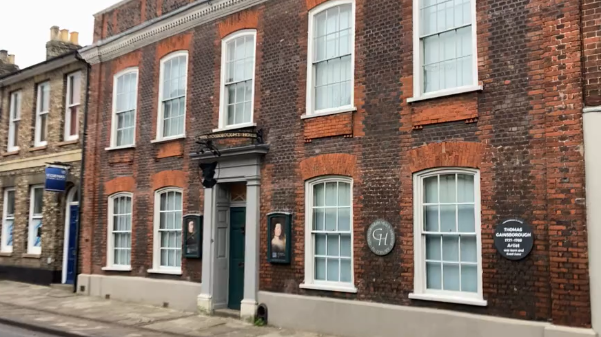 Red-brick Merchant House with white sash windows 