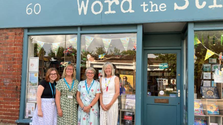 The staff of Word on the Street outside their shop.