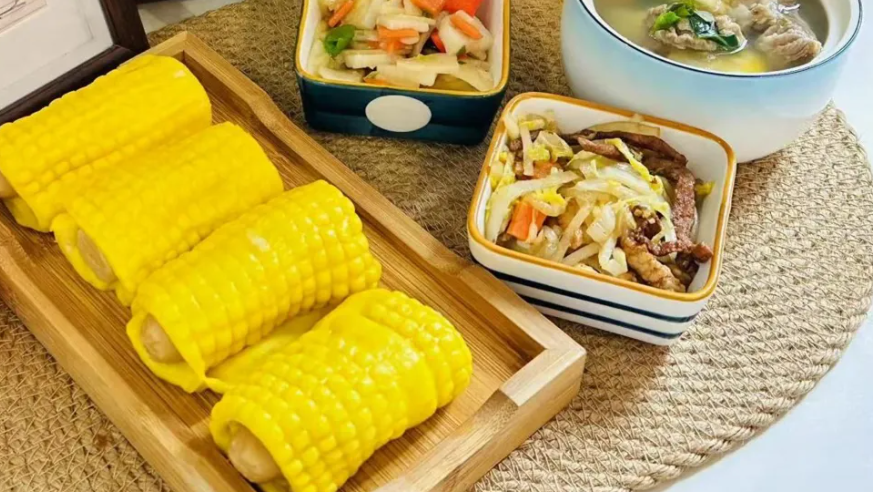 A photo provided by the kindergarten to parents show bright yellow corn rolls and stir-fried vegetables