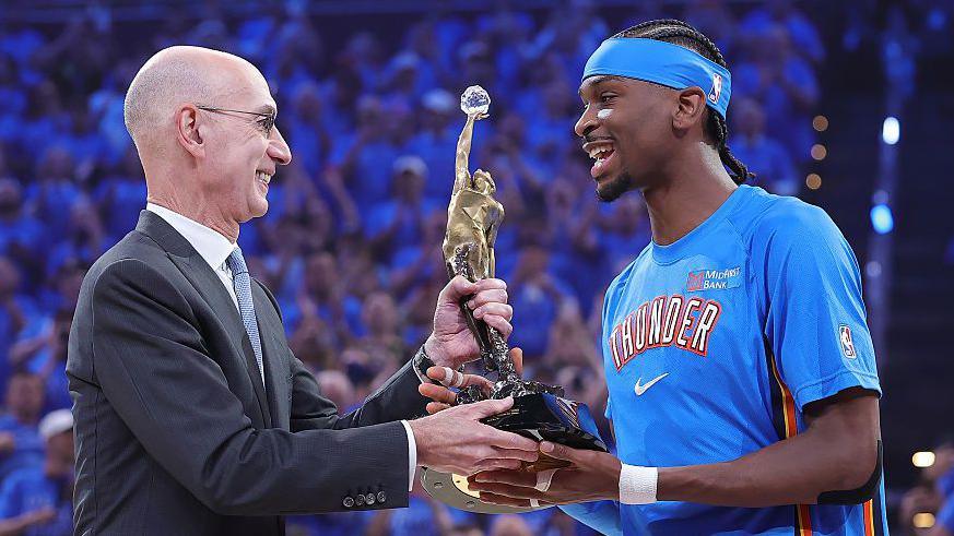 NBA commissioner Adam Silver presents Shai Gilgeous-Alexander with the 2026 Most Valuable Player award