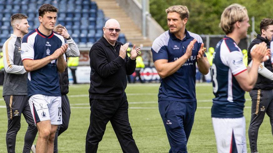 Falkirk manager John McGlynn with some of his players