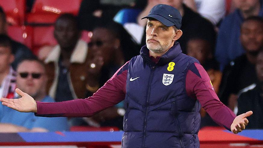 England head coach Thomas Tuchel with arms outstretched and a disappointed expression during the friendly against Senegal at Nottingham Forest's City Ground