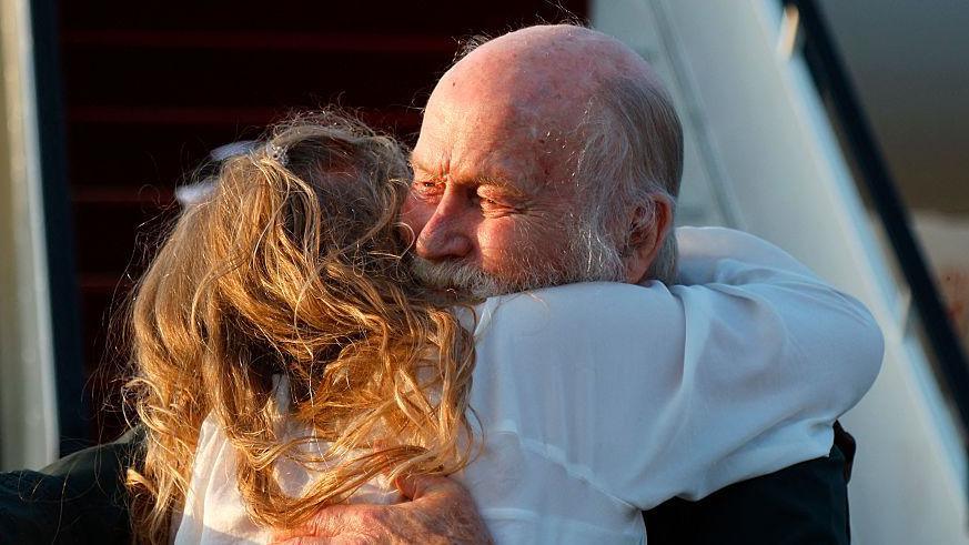 Peter Reynolds also hugs his daughter