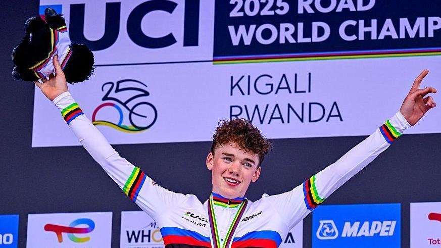 Harry Hudson celebrates winning the junior road race in Kigali