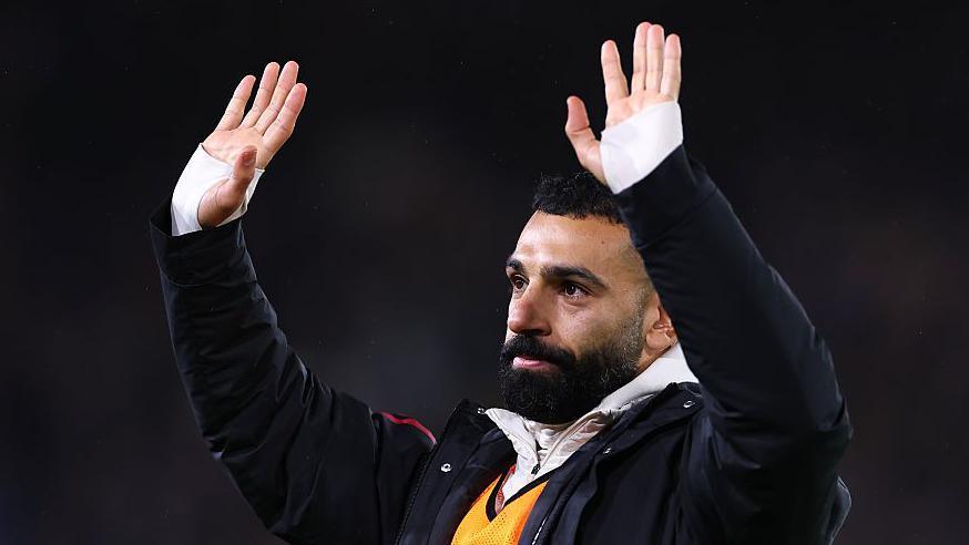 Mohamed Salah waving towards the Liverpool fans at Elland Road