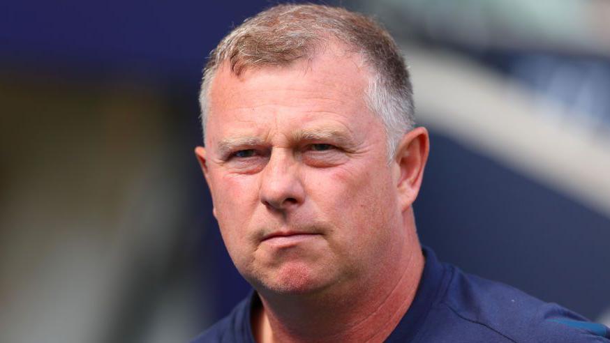 Mark Robins looks on from the sidelines as Coventry boss