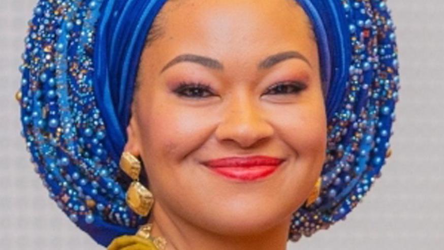 A close-up photo of Nigerian senator Natasha Akpoti- Uduaghan wearing a blue headscarf and gold earrings.