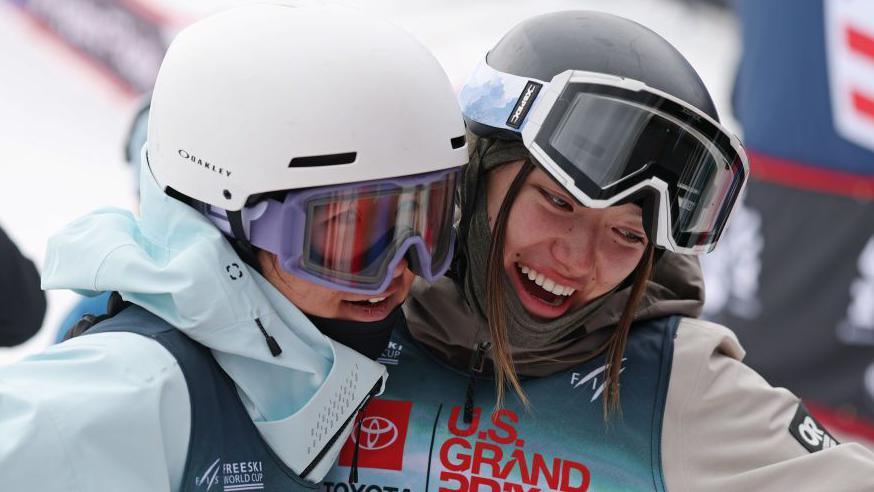 Zoe Atkin (right) embraces Li Fanghui after the World Cup in Aspen, Colorado earlier this month