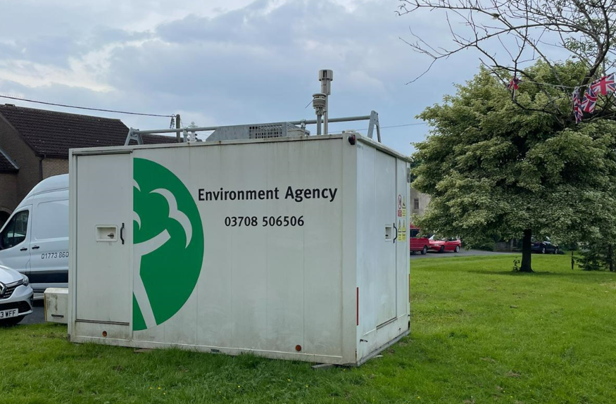 A large white unit with the Environment Agency in black letters