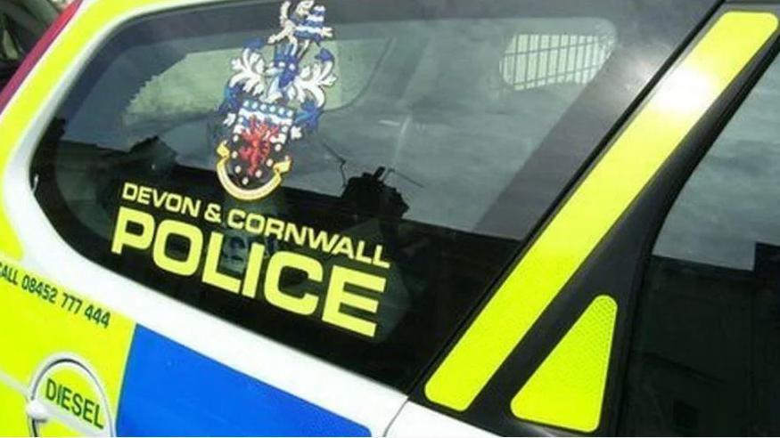 The rear window of a Devon and Cornwall Police vehicle