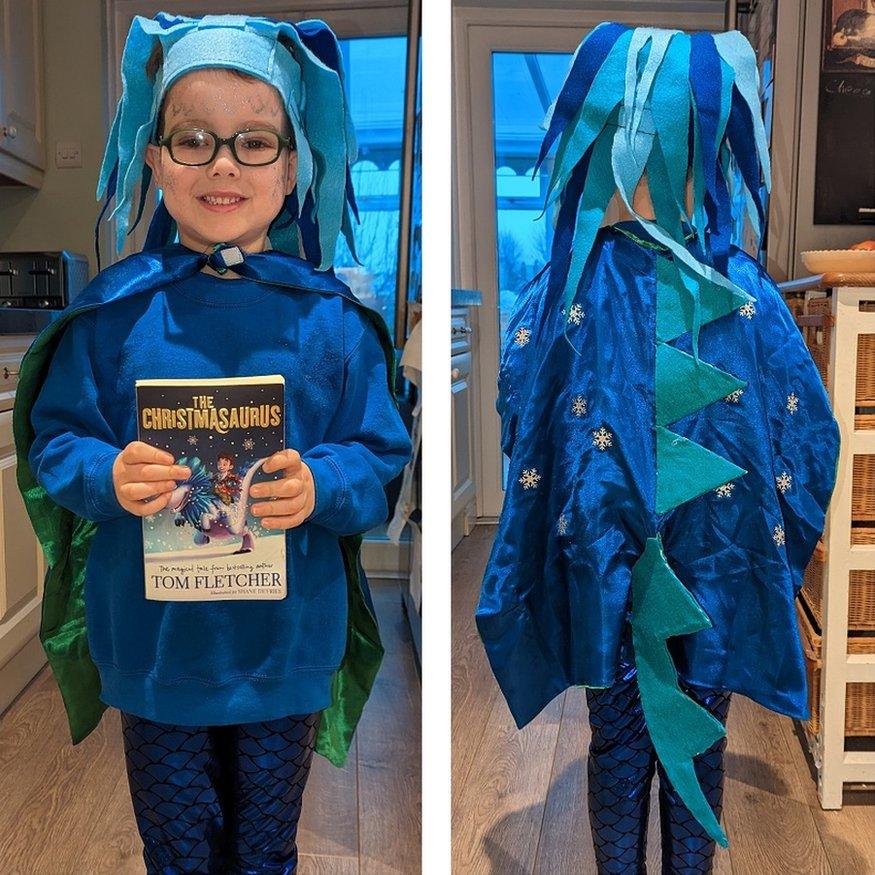 boy dressed as the christmasaurus