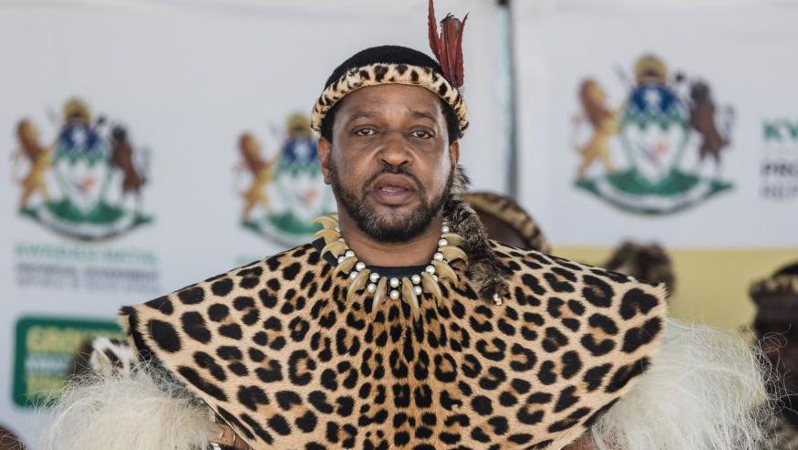 The Zulu king is seen here wearing traditional regalia as he looks on during a government event in South Africa's KwaZulu-Natal province.