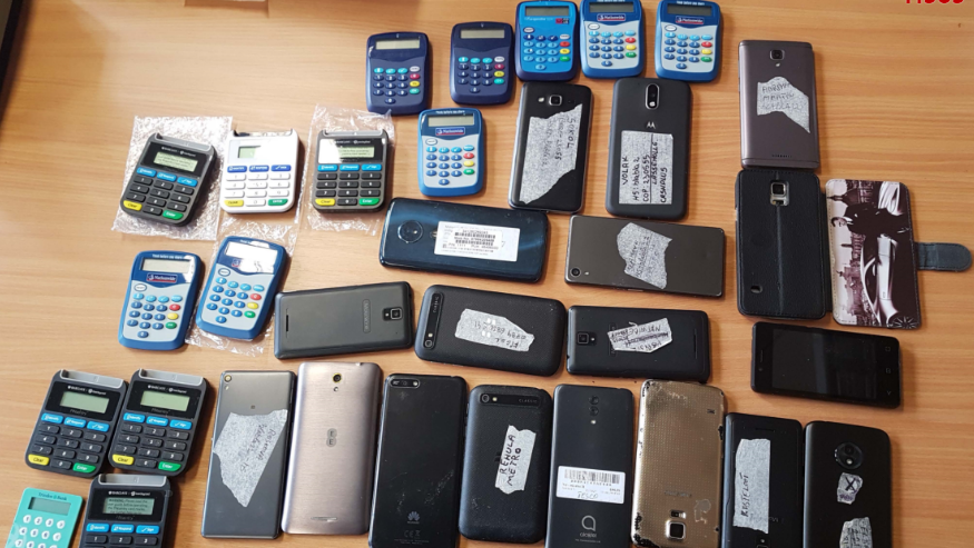 Phones and bank card readers found by police