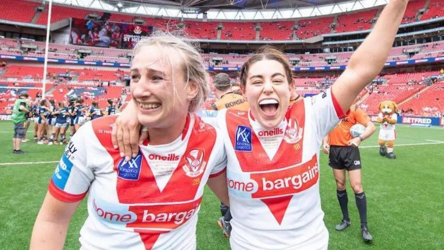 Jodie Cunningham and Emily Rudge pictured celebrating a St Helens win