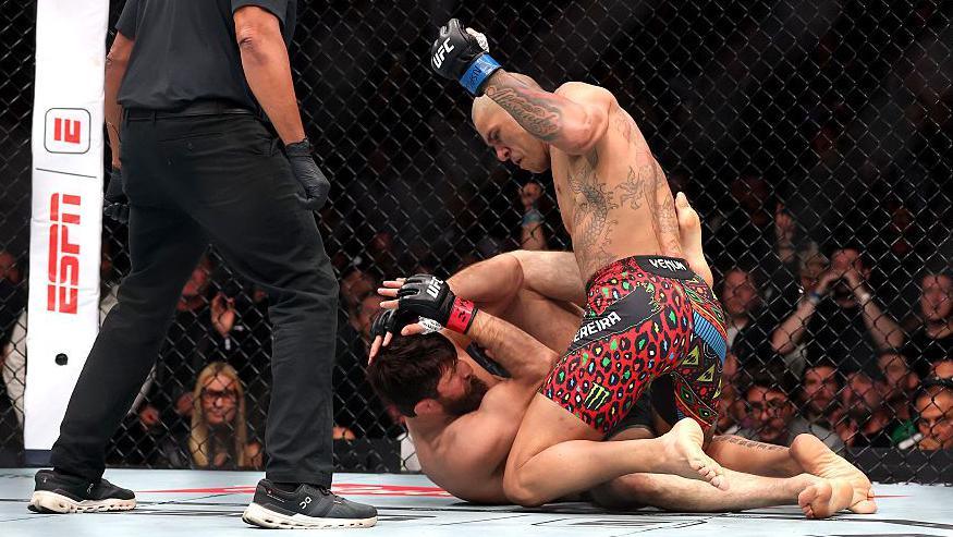 Alex Pereira punching Magomed Ankalaev while on top of him