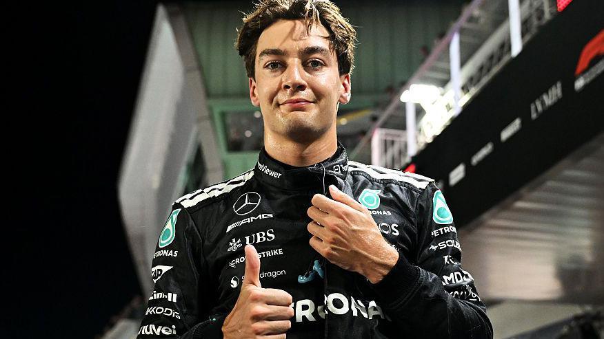Mercedes' George Russell gives the thumbs-up signal after taking pole position for the Singapore Grand Prix
