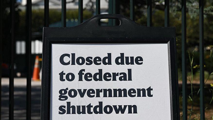 A sign outside the National Gallery of Art's sculpture garden in Washington, DC on 6 October 2025 says it is closed due to the federal government shutdown.