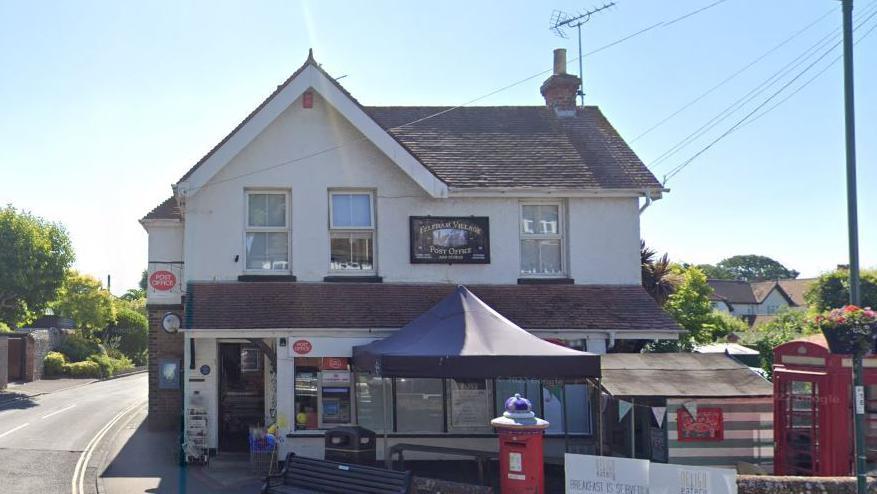 A Google maps image of Felpham Post Office, a white building displaying red Post Office signs on the corner of a junction 