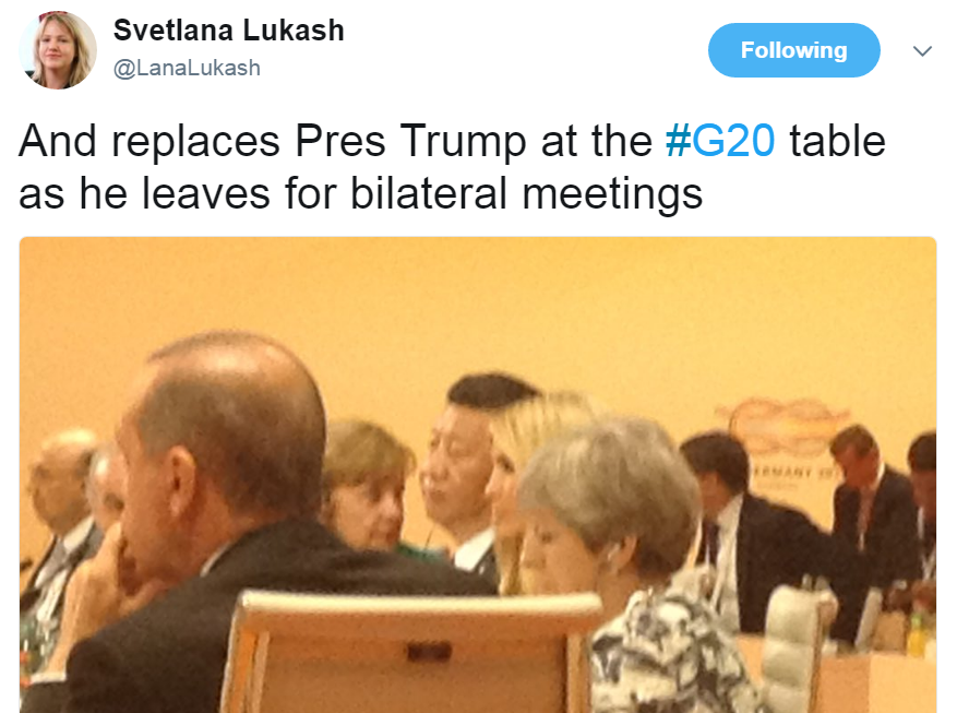 Tweet from @LanaLukash with a photo of the table: "And replaces Pres Trump at the #G20 table as he leaves for bilateral meetings"