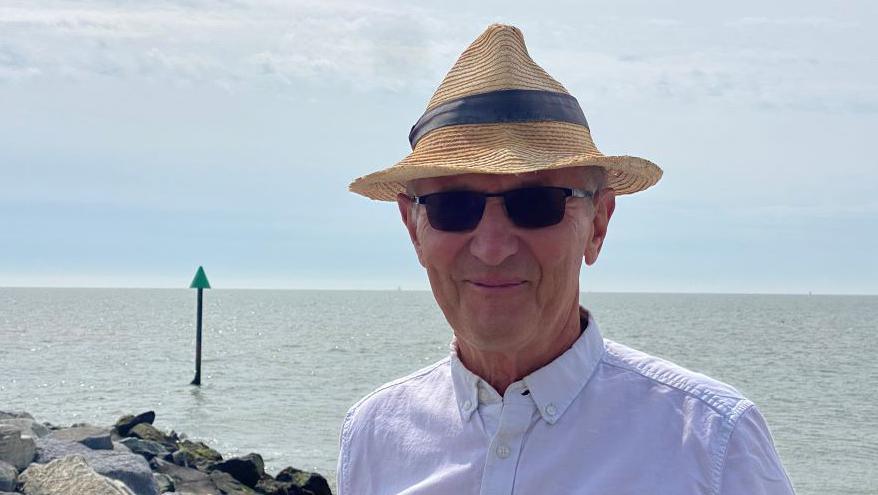 Mike Shute standing by the sea front in Framlingham.