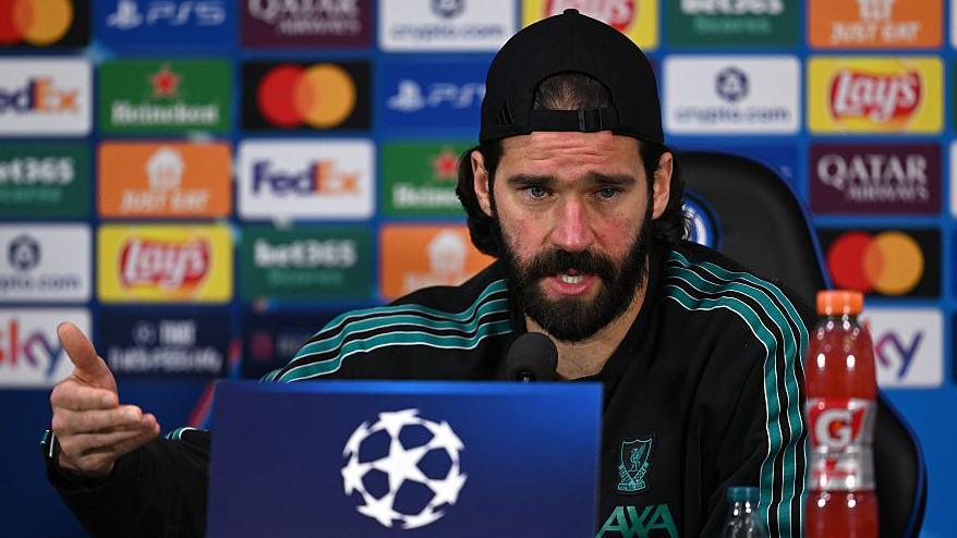 Alisson addressing the media at San Siro Stadium