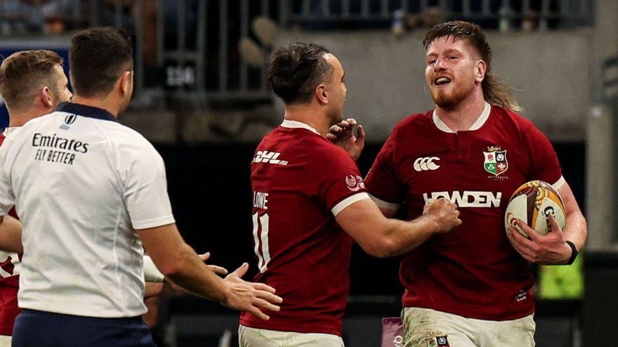 Ireland lock Joe McCarthy (right) celebrates scoring a try