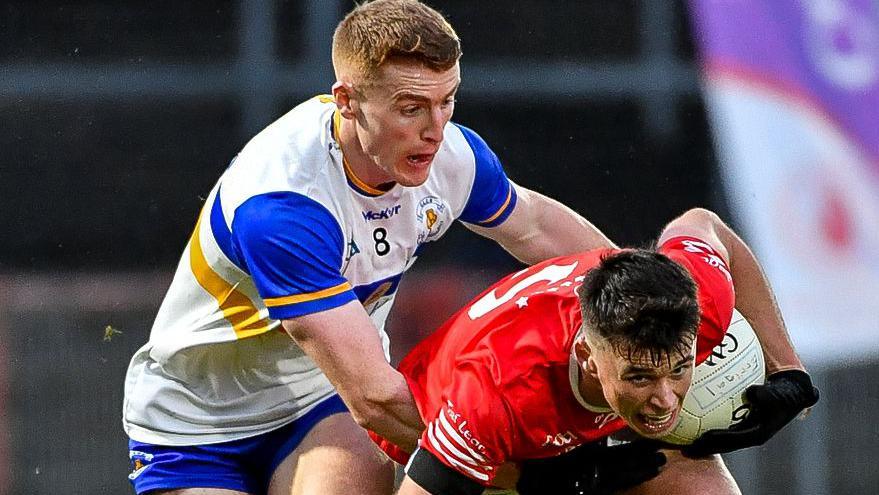 Tyrone team-mates Peter Harte and Liam Gray battle in last year's county final which Trillick won after extra-time