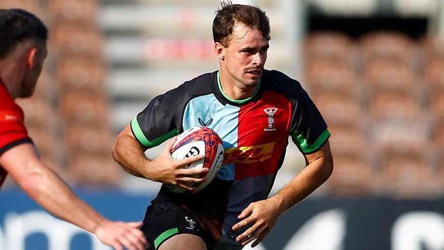 Cameron Anderson running with the ball during a Premiership Rugby Cup game