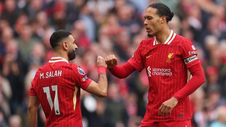 Mo Salah and Virgil van Dijk share a fist bump after Salah scored for Liverpool against Southampton in March