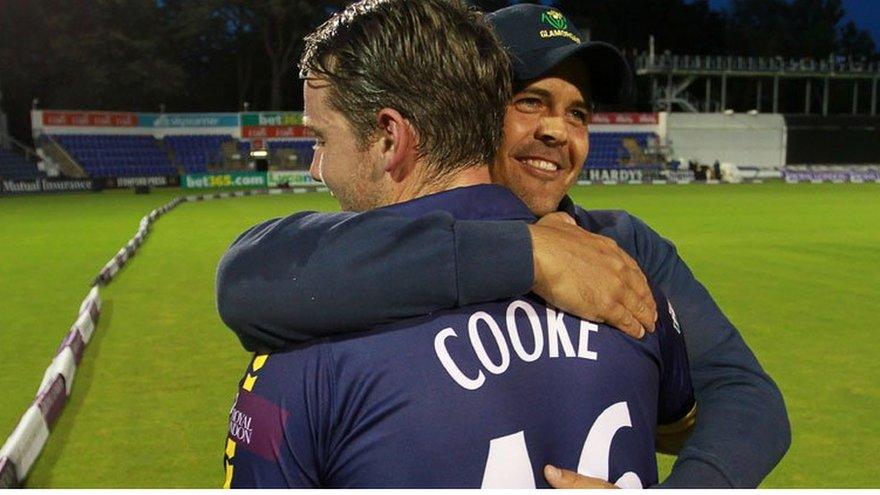 Chris Cooke is hugged by Glamorgan captain Jacques Rudolph