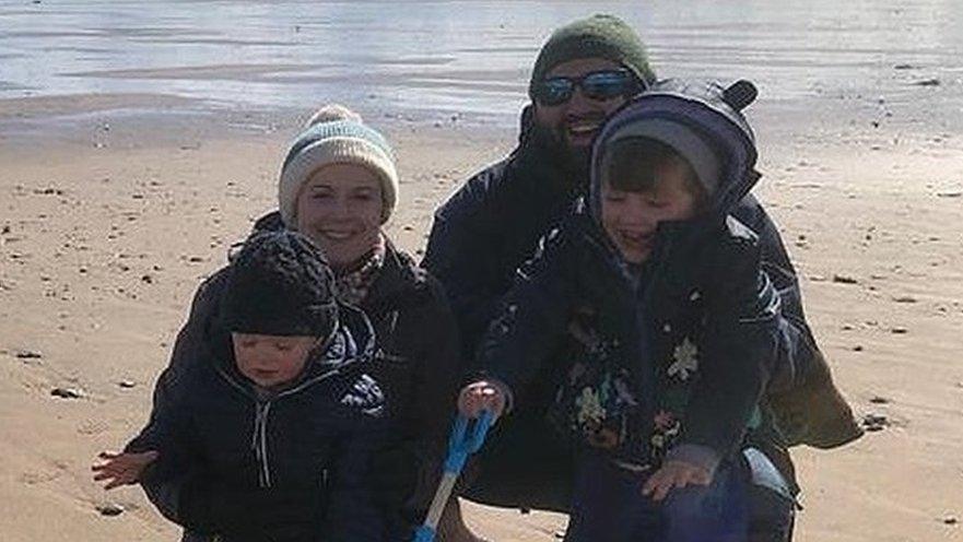 Ben Lightburn (top right) with family on a beach