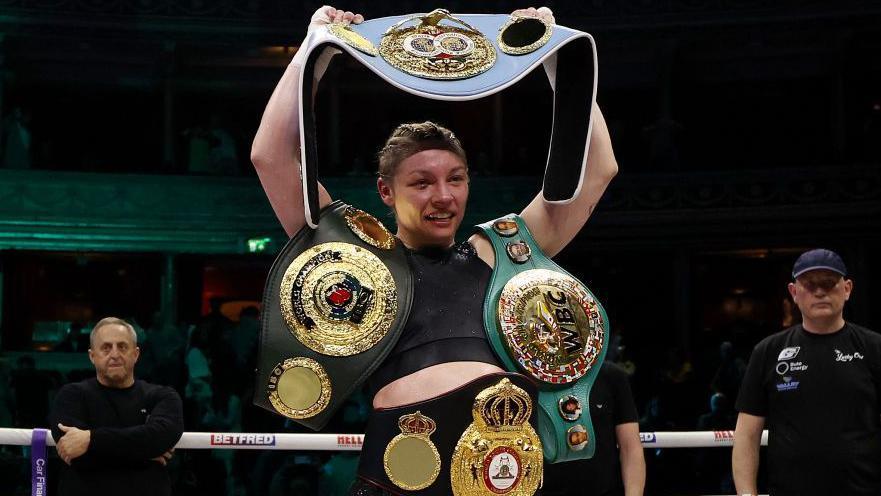 Lauren Price with her title belts after victory over Natasha Jonas in March 