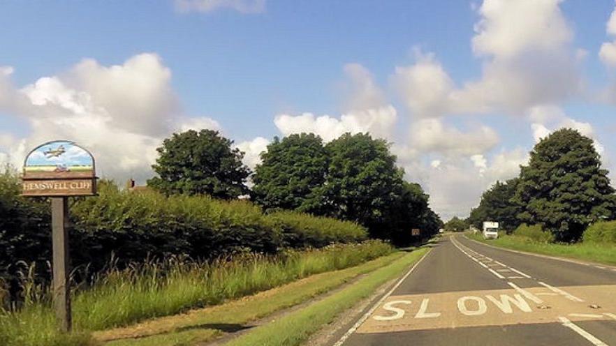 Entering Hemswell Cliff on A631, a road in the countryside