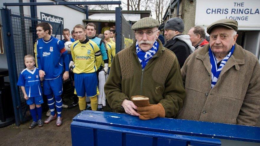 Two elderly Glossop North End supporters