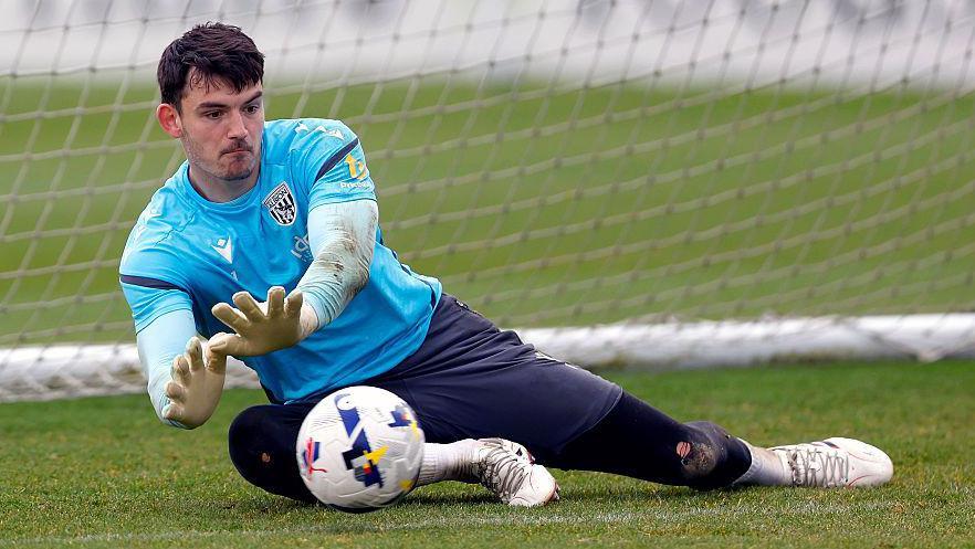 Max O'Leary dives to save the ball during a training session with West Bromwich Albion