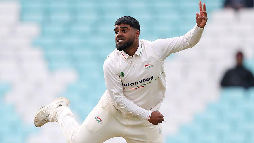 Rehan Ahmed in his follow through after delivering the ball during an over for Leicestershire